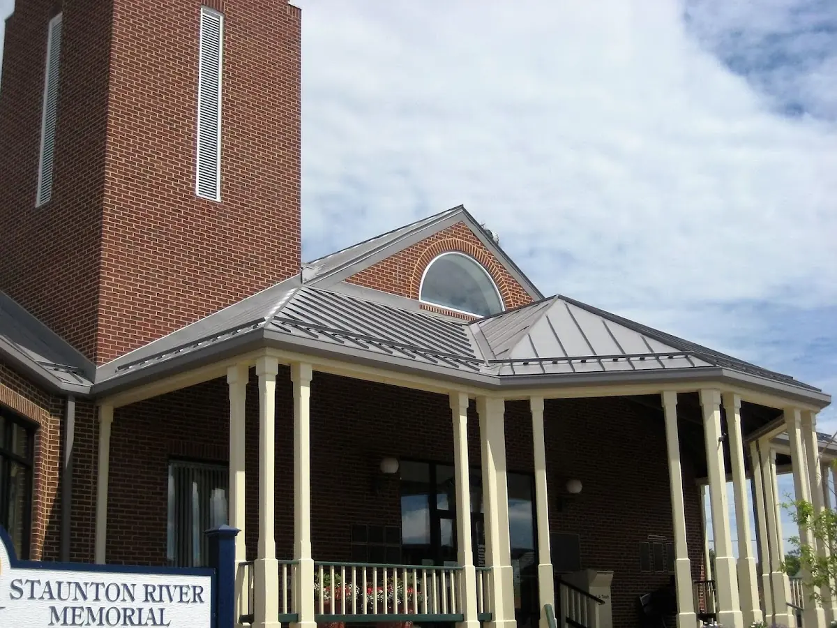 Skilled roofing craftsmen working on a residential roof in South Burlington
